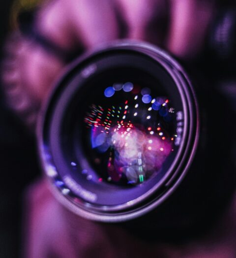 Vibrant reflections in a camera lens; an artistic photography close-up.